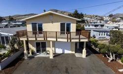 Great location on Pacific Avenue across from Cayucos beach. Recently remodeled and updated home with panoramic ocean views and easy access to the beach.Separate 1 bedroom,1 bath home in the rear currently rented and main home has also been used as a full