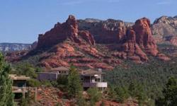 Sedona- A comfortable and ideal retreat captures unblockable views in one of Sedona's most prized homes-brilliant in execution of design and location. Undeniably impressive in architectural style, the living space is graced with 4,239 square feet, four