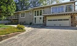 The original 1975 floor plan of this home has been newly modified to appeal to buyers looking for open, fluid living and entertaining areas with soaring ceilings and large picture windows capturing light-filled views of the rolling foothills. An