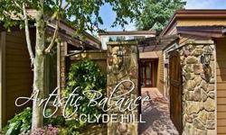 Stylish Clyde Hill home on a near 1/2-acre lot with bright SW exposure. Enjoy privacy and security with fully-fenced yard, courtyard entry, security system and cameras. Fabulous epicurean kitchen with gorgeous slab granite counters, tumbled marble