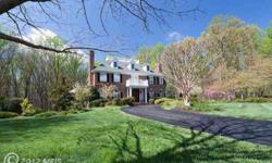 Stunning Georgian Colonial overlooking lush landscaping, large pool, spa, tennis court & playgrounds! Tucked away on a quiet cul-de-sac, adjacent to Scotts Run Nature preserve. Expansive deck & slate patio, fenced-in pool w/safety cover. Country Club