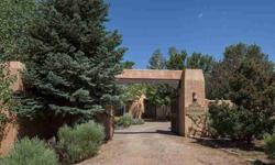 A lush garden oasis awaits you in the midst of Arroyo Hondo horse country. Just minutes from the Plaza in downtown Santa Fe are thirty-five acres with incredible views, 4,380 square foot main house and a 1,200 square foot two bedroom guesthouse. A very