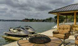 Large waterfront home on open water with amazing views, recently updated with Mesquite floors, chef's kitchen w/ commercial range, built in fridge, 2 wine fridges, custom fireplaces in family and master, 674 sq ft of outdoor living space with outdoor