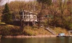 A 1986 built lakefront home with more than 180 degree view of Lake Thunderbird, 2 bedrooms 3/4 bath and a full unfinished basement has a washer and drier designated space in it.Floor to ceiling windows and sliding glass doors on the lake side of the house