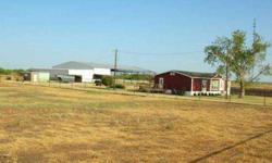 Great property for training cutting or rope horses, cow dogs, cattle pre-conditioning pens, etc 2008 manufactured home 3 bedroom, 2 bath - 1568 sq.ft. with 12 x 72 deck. Approx. 90 x 180 arena with approx. 90x 100 covered, lots of pipe pens all connected