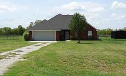 Well maintained four bedroom home on two acres. This nice country property is fenced for horses, has a small shop with concrete floors and electric, covered porch and separate fenced back yard. The home features split bedrooms, raised ceilings, open floor