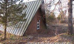 What a view! This property has so much potential. Cute A-frame with 3 bedrooms, and 2 baths, fireplace, and plenty of deck to take in the view. There is plenty of property to build a garage or another home. This is a Fannie Mae property you can purchase