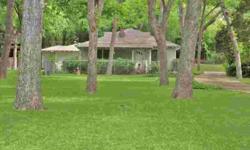 This wonderful White Rock lake home has a 100 X 372 foot deep lot, which is almost an acre. It has over 17 huge pecan trees and is so lush and beautiful. Barbaree Boulevard reminds you of a country lane miles from the city, but is just 5 miles for