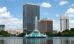 Short Sale. Gorgeous two-story Manhattan style one bedroom loft featuring stainless steel appliance package, granite counter tops and hardwood floors. Stunning views of Lake Eola thru floor to ceiling glass walls. Upgraded full sized stack washer and
