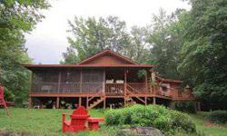 Rocky River Log home on 20.8 acres with the look and feel of a mountain retreat that offers privacy. Cool during the day in the inground pool, relax in the evening on the screened porch or on the deck that overlooks beautiful hardwoods and timber. Home