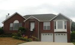 Like new brick home in Cookeville, TN. Masterfully detailed this custom brick home offers a larger family room with log fireplace that connects with easy access to a formal dining room. Kitchen offers open space with a connection to the bright sun-room,
