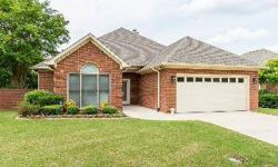 Light and airy! This full-brick rancher has been beautifully updated and offers all new appliances, new windows, and tiled floors in wet areas. An open floorplan accentuates the home and the family room is enhanced by the warmth of a fireplace. The master