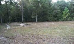 2.7 acres with well, septic and power pole. This is a corner lot with wild azaleas, pines and oaks. There is a community pool and fishing lake with horse stables. The lot is for camper, house or mobile home. Close to shopping and entertainment such as