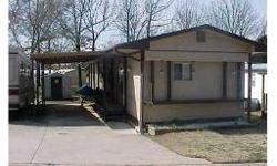 SIT BACK & RELAX! This 1975 model, two bedroom, two bath mobile home is located in a 55+, mobile home park and offers 1068 sq feet of living area. features include central HVAC, ;carpet and tile floor coverings, eat in kitchen, bonus storage room, storage