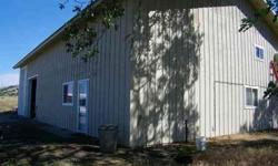 Dividable acreage, 40x60 pole barn has deluxe living accommodations, great room concept for kitchen and living roo. Laundry, bath, several rooms upstairs include media room potential. Ceramic tile with granite accents, some wall to wall carpet. R 38