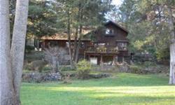 LAKE FRONT LOT INCLUDED with this Charming one-of-a-kind Chalet on almost 3 acres.Park like setting,complete privacy.Reflects owners pride in detail.Income property as well!! Guest house currently rented for $995. per month,could be used as