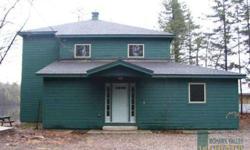 This custom built home is located on Spruce Lake in the foothills of the Adirondack park. Quiet and peaceful lake front home with a little TLC and some minor finish work you can have a beautiful home. Spacious room sizes with open floor plan and second