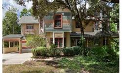 Authentic Queen Anne Victorian rises from the center of 15 acres of natural Florida vegetation zoned for horses. Adjoins 700 acres of trails --BLACK HAMMOCK WILDERNESS... Built in 1989 using owner's private collection of vintage materials and antiques.