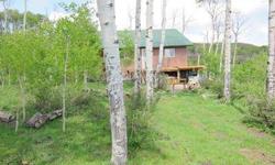 Two cabins nesttled in the aspens, both with solar collectors and facing south with abundant light. One has two large bedrooms, a 3/4 bath and an outstanding great room, a sweet little kitchen set up, fine dining area and spacious living room. The 2nd