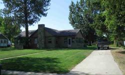 This historic home is located at 1109 East Kansas Avenue in Fort Peck with views of the Missouri River. It has an open remodeled Gourmet Kitchen with stainless steel appliances, a large dining room, living room with fireplace and hardwood floors
