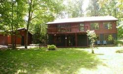 This 4bed/2bath cedar sided home sits on 2.6 acres of land with 200' of level, frontage. Located very near Eagle River, but gives you the privacy that so many have been searching for. The interior offers a wood fireplace, tongue and groove paneling, a