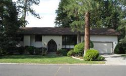Tremendous home nestled in the Highlands neighborhood next to the Spokane Country Club. 4 bedrooms, 3 baths, formal dining area and formal living room with fireplace. Spacious master bedroom with master bath, full finished basement with 2 family