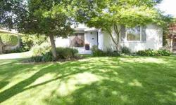 Enjoy the beauty of nature and the comforts of home as you find this darling property nestled quietly alongside a fabulous tree lined street. The grounds have been skillfully landscaped, and feature lighting accents on the patio and beyond the french