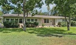 Modern mid century appeal in this updated home on a .33 of an acre corner lot a short walk from Southwestern University. Wood floors, granite counters and can lights lead the way from the spacious kitchen and dining area to the family room decked out in