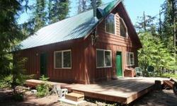 Like new, fully furnished Priest Lake getaway. This property sits just 200 yard from the lake and right next to Hills Resort. Enjoy the half acre treed lot with filtered lake views. There is also an adjoining one-third of an acre available for