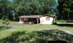 Just a short 10 mile drive out of Old Town and only 8 miles to Cross City is your cute and compact concrete block two bedroom one bath home on approximately 1.25 acres. Living room, separate family room (or possible third bedroom), combination