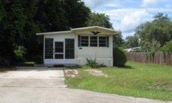 12X46 BUDDY SINGLEWIDE WITH NEW CARPET IN LIVING ROOM, 2 NEW CEILING FANS, LARGE VINYL ENCLOSED PORCH AND LARGE LAUNDRY ROOM. 10X12 STORAGE BUILDING.