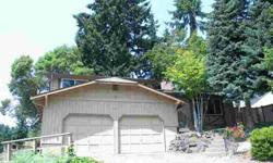Great Tr-level home with large fully fenced backyard, 2 car garage, and multi level decks! This property also includes a bonus with separate entry and kitchenette area!!! Hurry this University Place property won't last!!!Listing originally posted at http