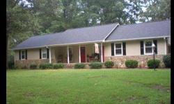 Halfway between Anderson,SC and Greenville, SC, this home is not only in a well-established neighborhood surrounded by beautiful hardwoods but you can walk out of your backyard straight onto the 13th fairway of Saluda Valley Golf Course.Listing originally