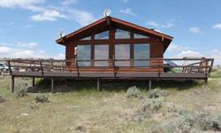 The perfect year round living or seasonal cabin. 40 acres with views of Oregon Butte. Private well and solar power. Includes a 30x40 garage/shop. Close to Atlantic City and South Pass City Wyoming. CALL FOR YOUR SHOWING TODAY Toll Free 1-877-998-9904