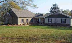 Very open spacious updated brick ranch with new addition of two car garage,bonus room,fireplace added. Sitting on unrestricted 1.90 acres with fenced in backyard in the heart of Powdersville. Mature Fruit Trees & Shrubs! Totally renovated with new