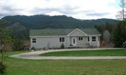 Lovely 5 bedroom, 3 bath home on 2.59 acres. Skookum Ck. crosses one corner of the property. Propane fireplace in livingroom. Spectacular views of the mountains to the east from full length wrap-around deck. Very private setting.
Listing originally posted