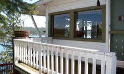 Classic Loon Lake waterfront cabin on 50 frontage feet. Secluded setting with lakeside terrace. 3 bd, 1 1/2 bath. Open floor plan with views from the kitchen, dining, living & great rooms. Large newer dock & vintage boat house. 2 parcels / lots , dramatic