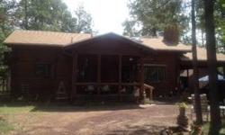 Real log cabin, nice large great room, very open. 2 bedrooms, 1 bath down, large loft with outside balcony and 1 bath up!! Separate building approx. 12x20 could be workshop, storage, guest quarters or...?? Large lot and huge back yard!!Listing originally
