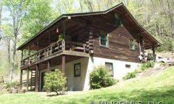 that boasts rolling acres & bubbling creek w/mtn views,600 sqft art studio/guest quarters w/front porch & carport. Renovated cabin w/some vaulted ceilings,HW floors in kitchen & LR,lovely MBR w/sitting rm & private screened porch w/gorgeous views,updated