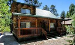 Traditional cabin in the woods. This is a true log cabin with beautiful hard wood flooring and a metal roof. This is a latch key property for a weekend getaway to get out of the heat. With a covered front porch that runs the length of the cabin you can