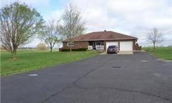 Beautiful home on 4.5 acres just outside of town on State Highway. 3 bedrooms are very roomy and home is very well-maintained. Living room, family room, and full basement. Sun room and 40x60 Morton Building with car rack, hoist, concrete floors, and