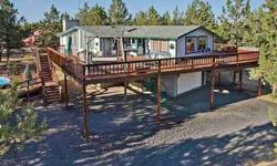 Cascade Mountain View for this spacious 4 bedroom home with room for your family, pets and all the toys! 2 Acres! Solar heated pool, hot tub, large deck to entertain or relax & watch the horses in your corral. 30X36 ft shop with concrete floor and 2-car