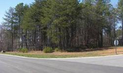 One of the few remaining lots in an upscale community in Lake Norman. Cul-de-sac with seasonal waterview and surrounded by million dollar homes. Flat and wooded lot on .556 acre and 4,600 sq. ft impervious. Call listing agent for approved builders,
