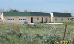 Energy efficient ''earth-berm'' home on 2.8 acres, 3 bedrooms, 1.75 bathrooms, open living space, sunny kitchen, mudroom, lots of storage, 27x32 garage, and 1200' patio for relaxing and entertaining. Call Carol at 307-660-3262.Listing originally posted at