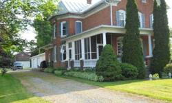 Orangeville. Stately brick Victorian residence with open staircase on .8 acres with garages and barn. Wonderful setting.Listing originally posted at http