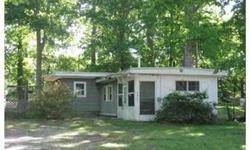 "Seller says Bring Offers" This cottage is situated on a quiet, dead end street. It is unique and compact and has lots of potential. Enter through an enclosed porch - the living room and kitchen open to one another. The gas stove, the refrigerator and
