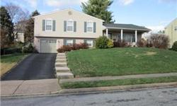 Large Split level in Village Green Knolls. 4BR/2.5BA with a large double rec room. Brick and vinyl outside. Large yard and deck make this outside perfect. This property is in move-in condition. Just come in and see for yourself. Updates include: powder