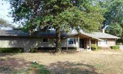 This wonderful home with lots of updates sits on just over an acre close to Ponca City! The kitchen has beautiful new cabinets and quartz countertops and stone backsplash. Home has lots of new oak wood throughout. The bathrooms have been updated with