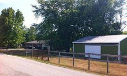 This is a perfect home for peolpe who like the out doors. Over eight acres with 1000ft of Big Surgar Creek shore line, a horse barn with 2 stalls, above ground pool & a hot tub. The are several updates, Kitchen, Sun Room, both baths and a new roof (all in