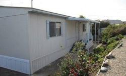 WOW!!! NO SPACE RENT in the Desirable 55+ Whale Rock Mobile Home Park !!! Only one short block from the beach. This Double Wide has an addition that can be third bedroom or Office. Price includes Park Shares. Location Location Location !!!!! New Carpet